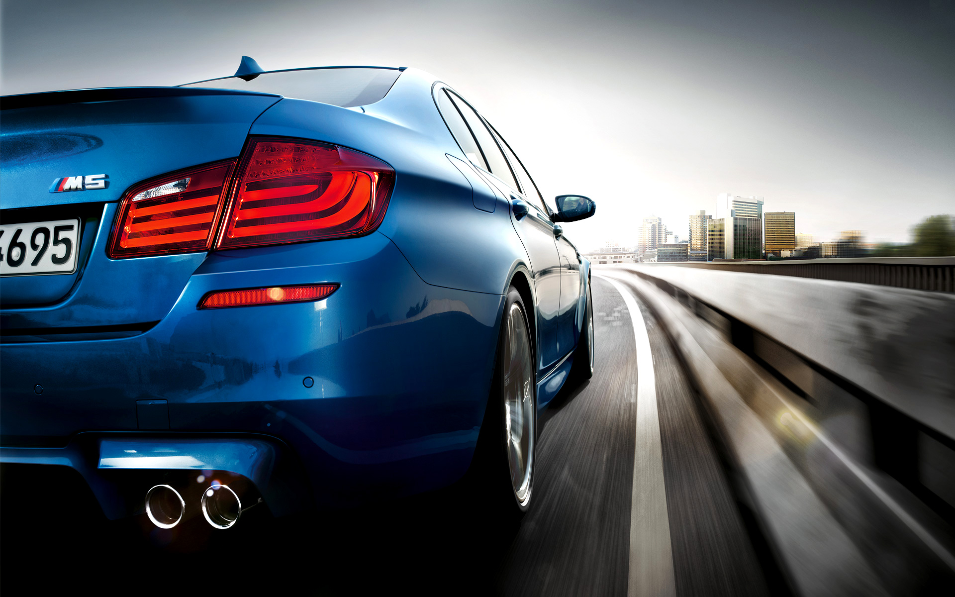 BMW M5 speeding on a highway