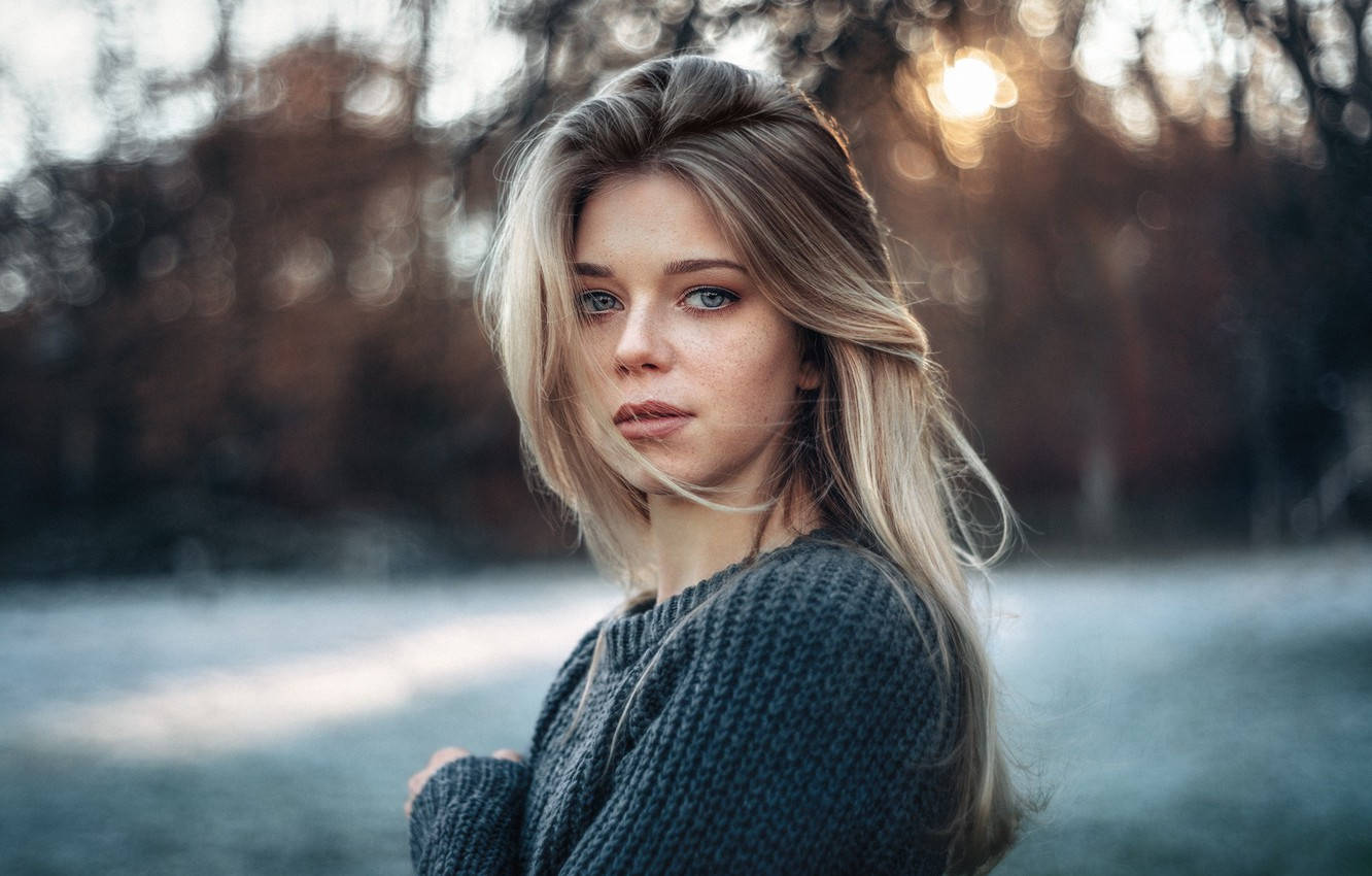 A German Girl Showcasing Her Ombre Hairstyle In Laid Wallpaper