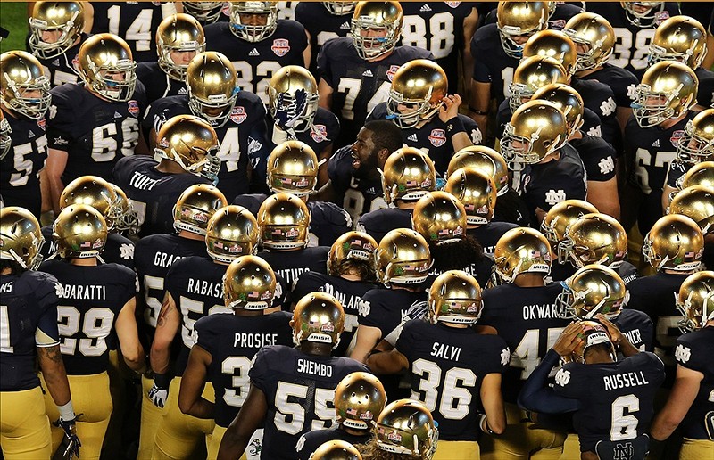 Notre Dame Fighting Irish Players Gather Around Co Captain Defensive