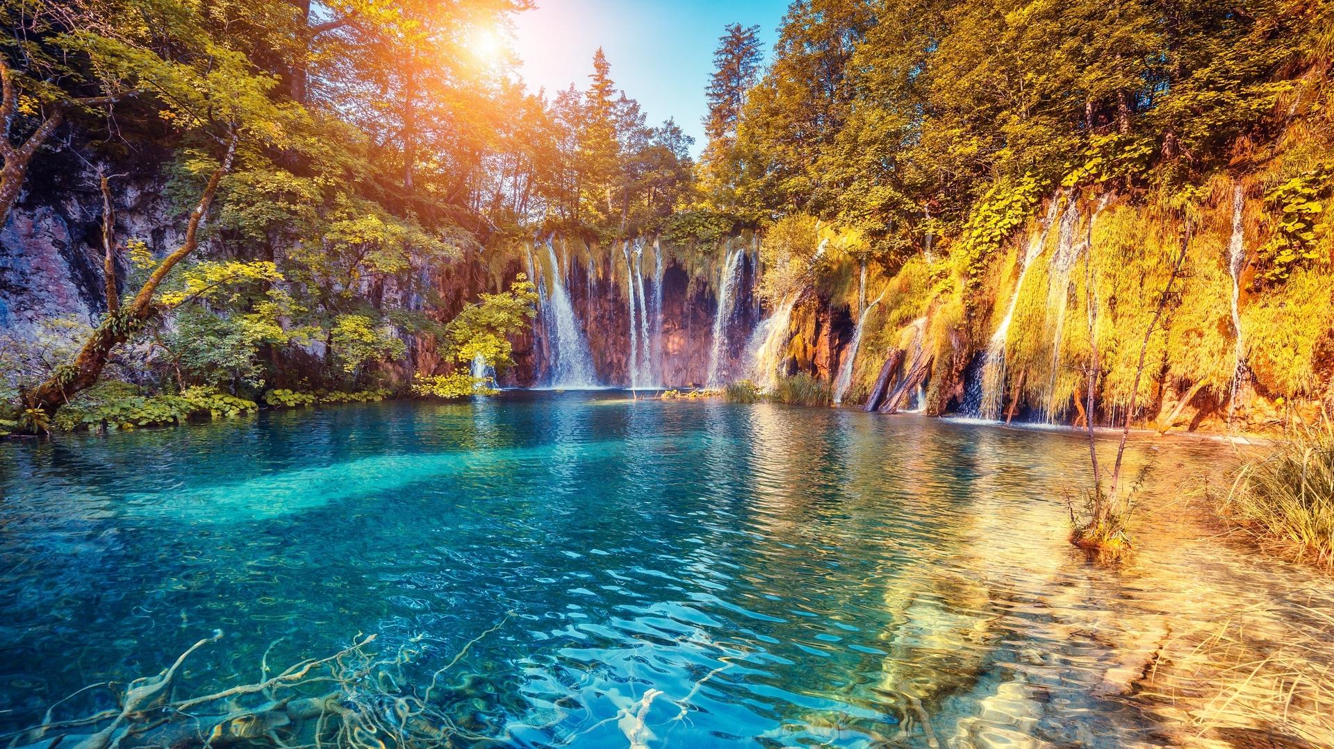 Beautiful Summer Sunrise Over The Waterfall In Mountains