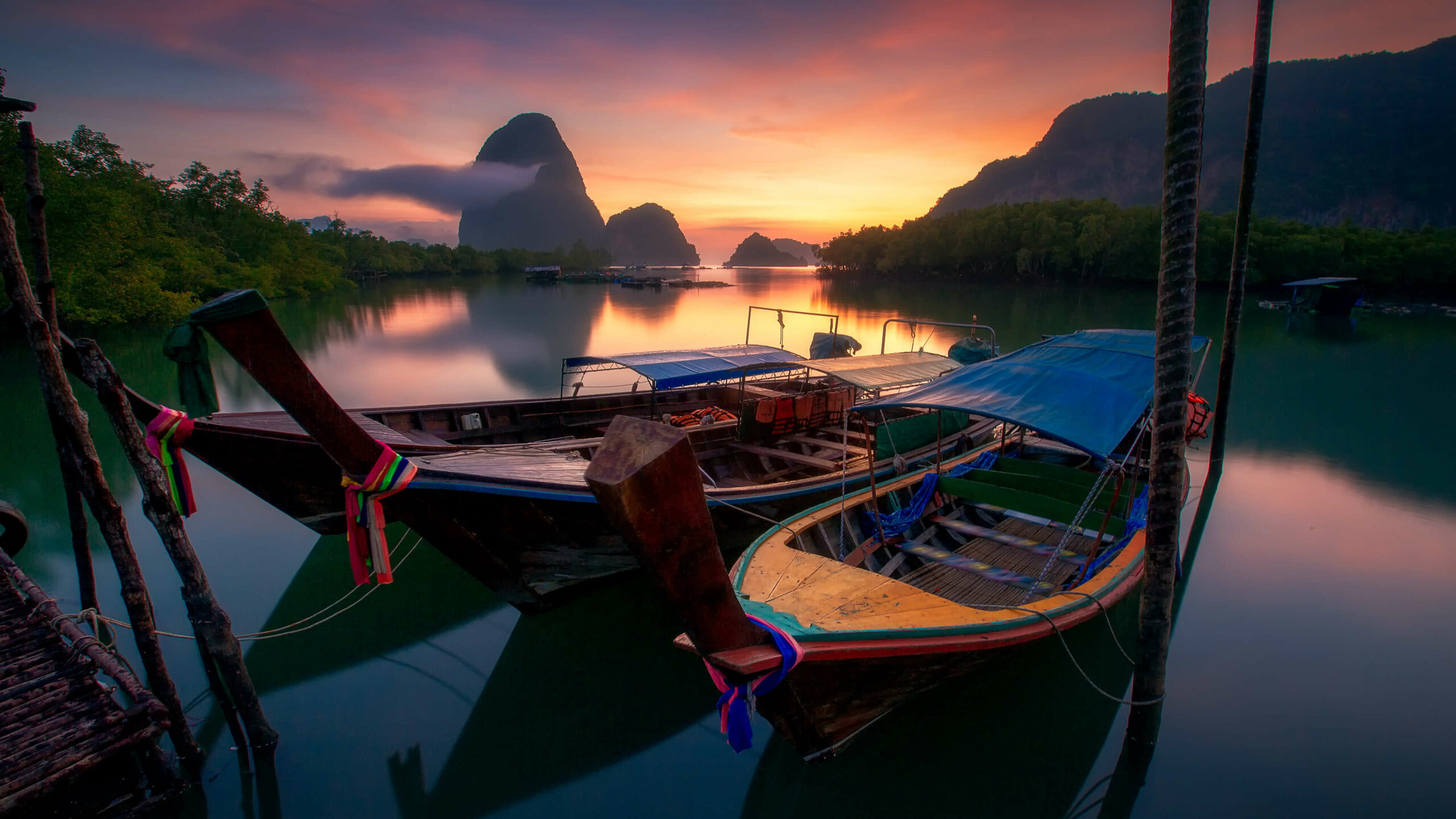 Longtail boats at sunrise in Phang Nga Bay, Thailand