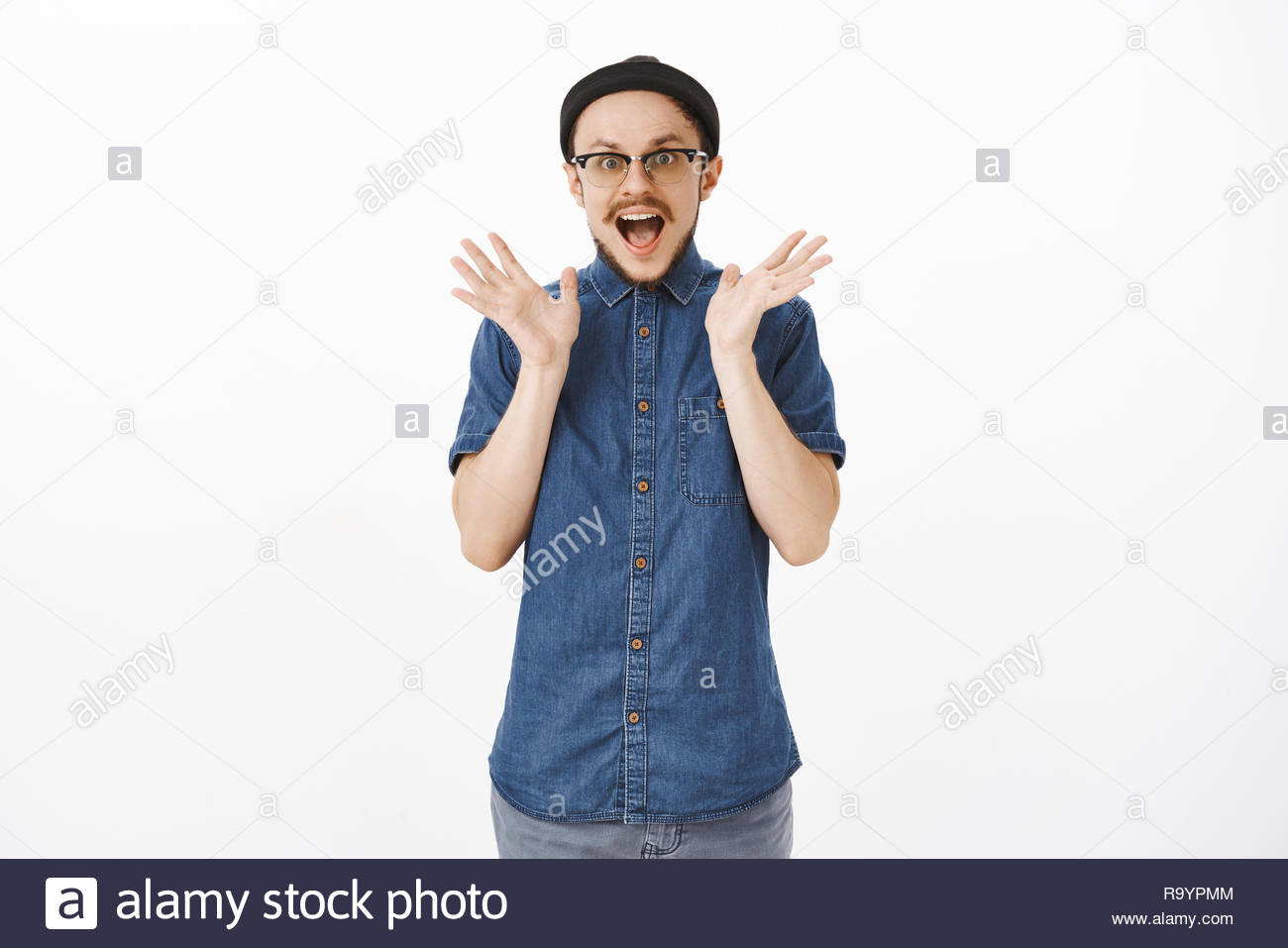 Portrait Of Man Losing Speech From Excitement And Thrill Shaking