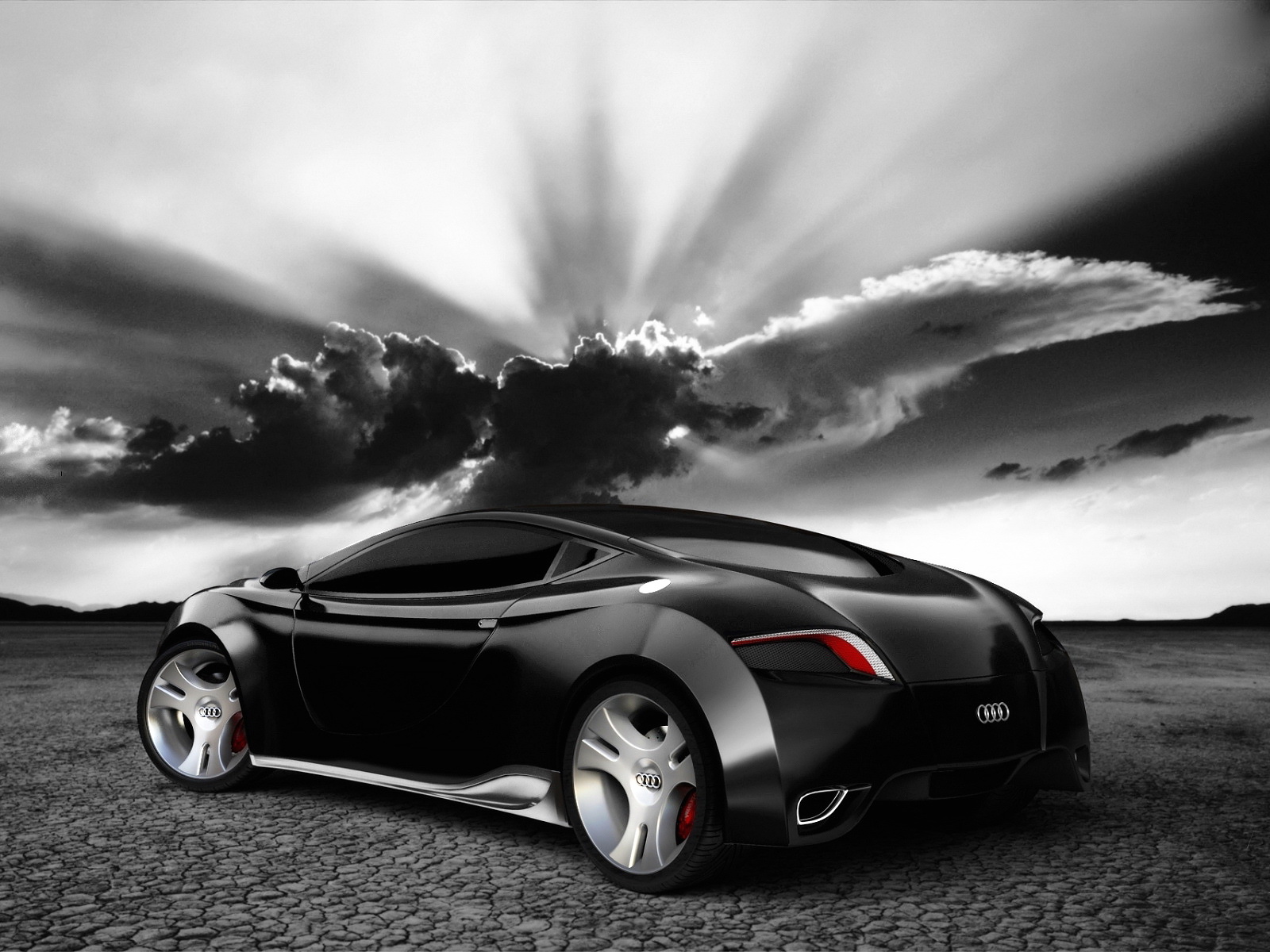 Sleek black Audi concept car against a dramatic sky