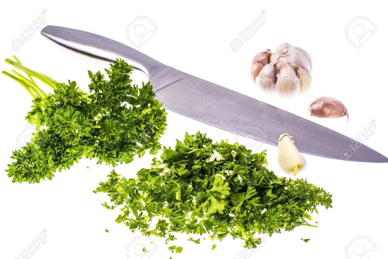 Finely Chopped Parsley And Garlic Isolated On White Background