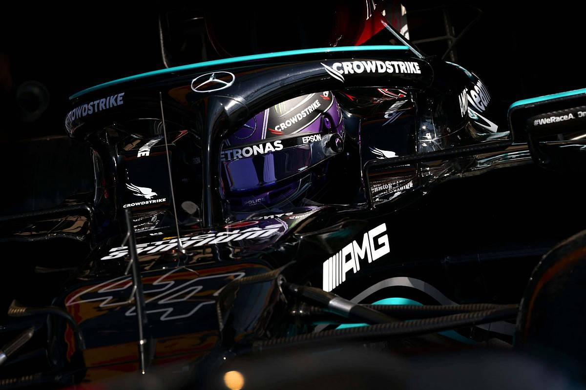 Download Lewis Hamilton Inside Black Mercedes Wallpaper