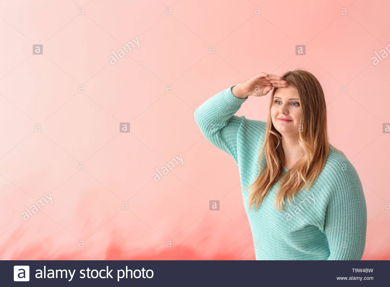 Beautiful Plus Size Girl Looking Far Away On Color Background