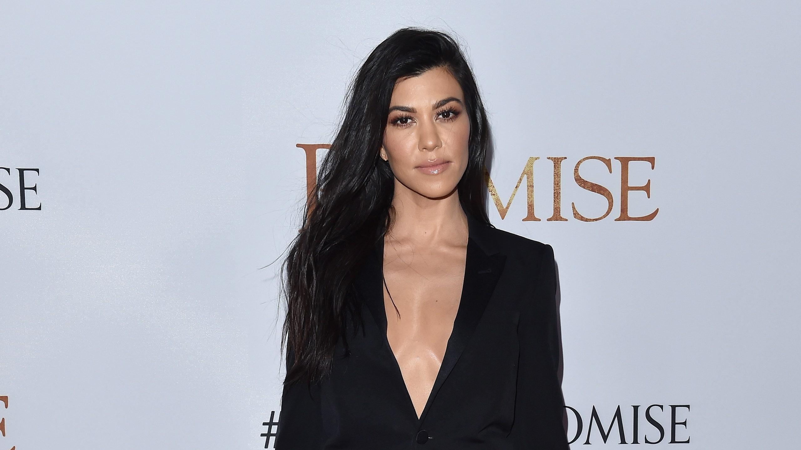 Kourtney Kardashian Shuts Down Pregnancy Rumors In Tight Fitting
