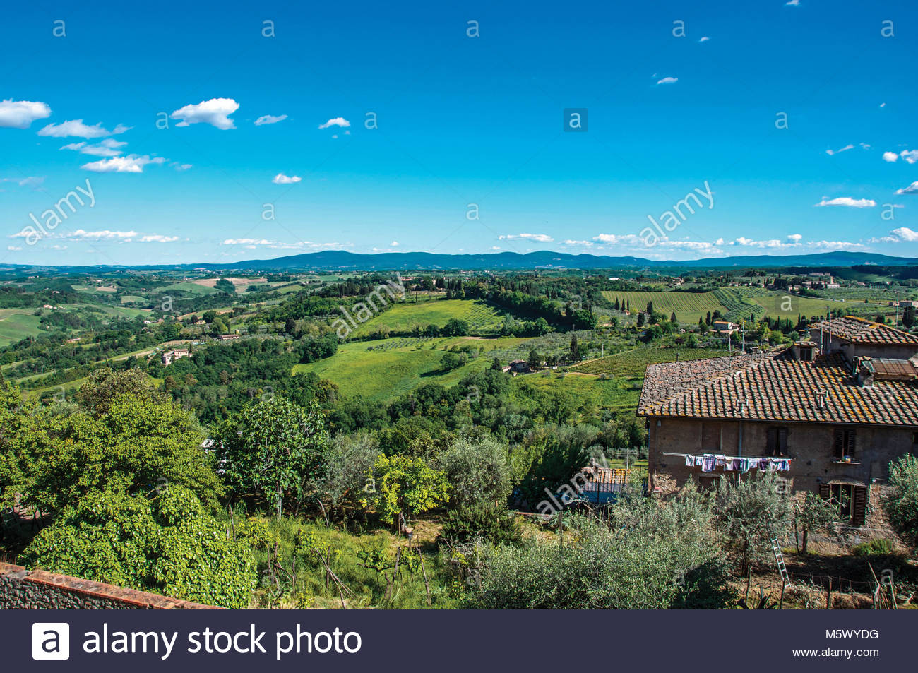 Over Of House With Green Tuscan Hills In The Background At San