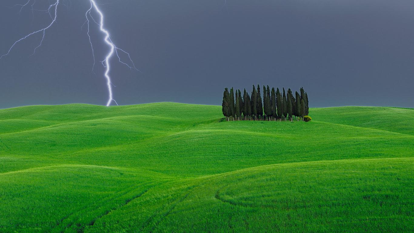 Lightning Strike Near A Grove Of Cypress Trees Val D Orcia Italy