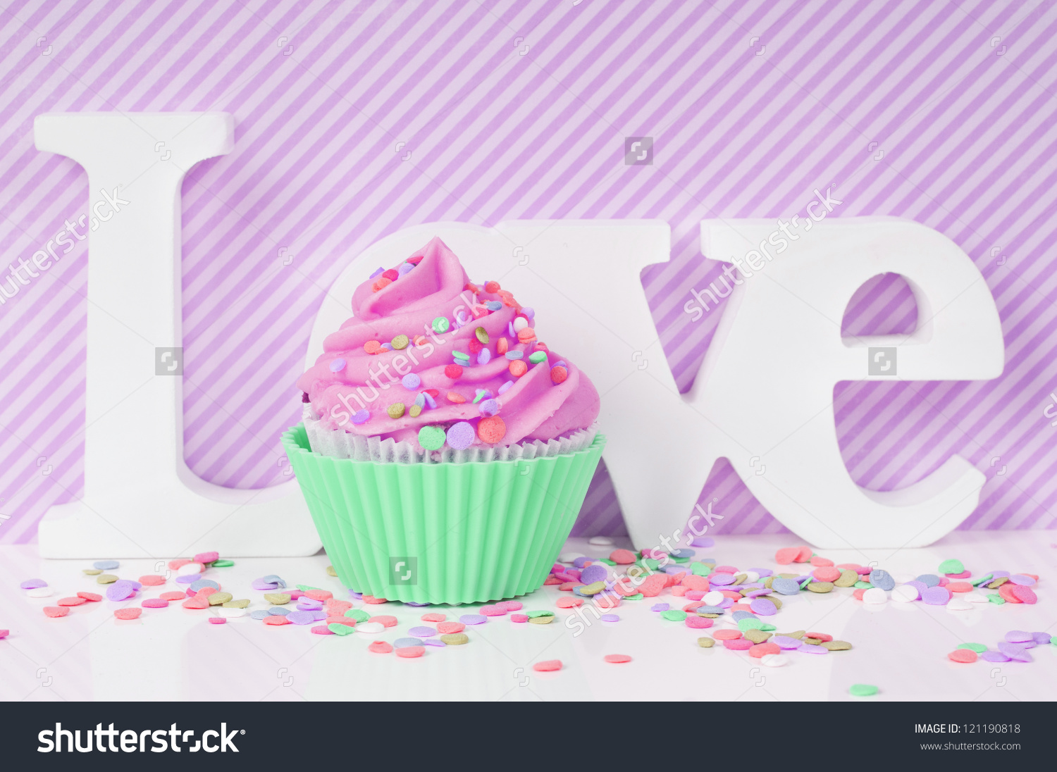 Pink Cupcake On A Striped Valentine Love Background Stock Photo