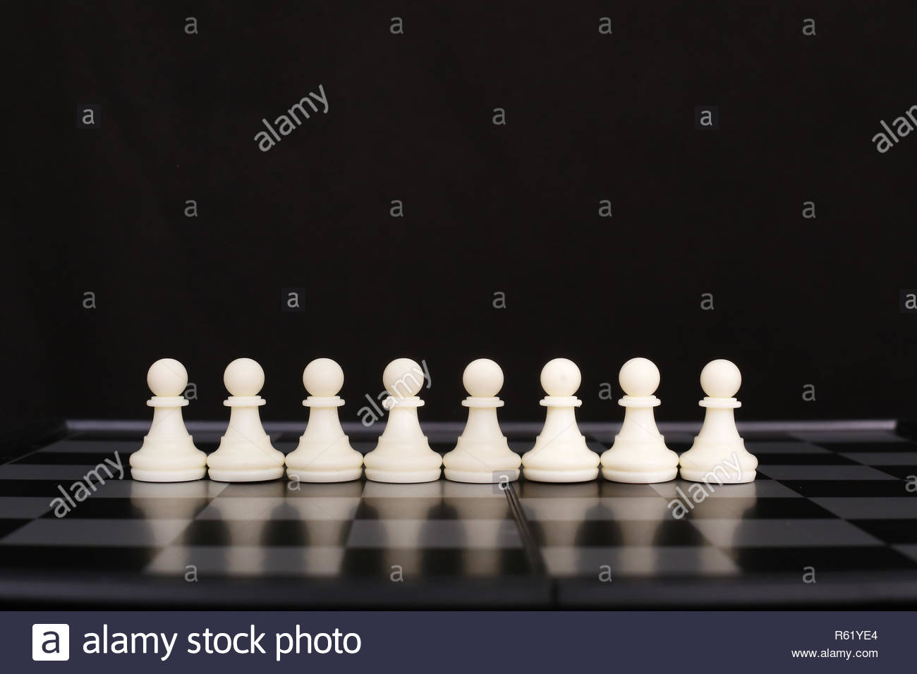 Picture Of White Chess Pawn And Chessboard Isolated On The Black