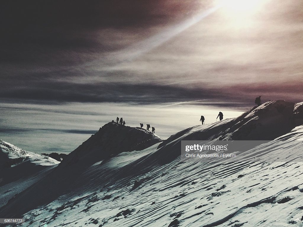 Silhouette People Hiking On Snow Covered Mountains At Arachova