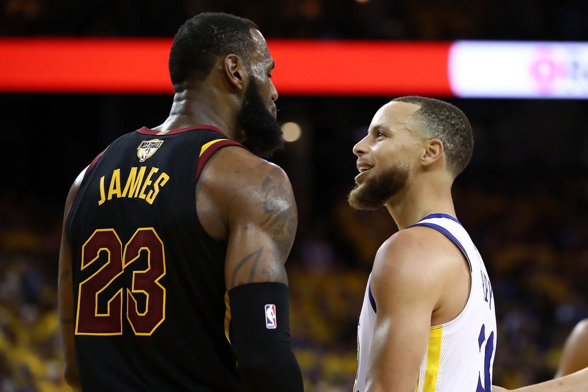 Lebron James and Stephen Curry face off during an NBA game