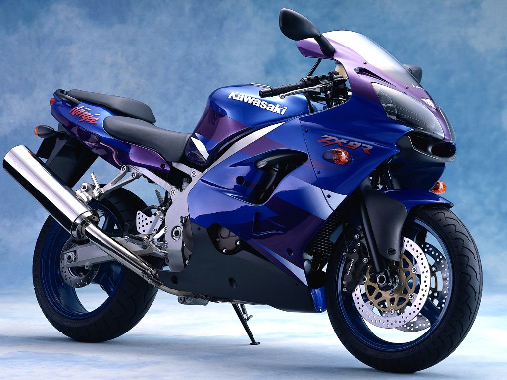 Kawasaki ZX-9R sportbike against a vibrant blue backdrop