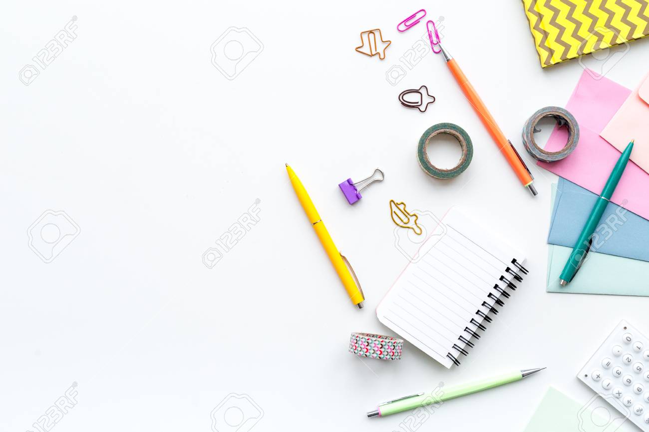 Scattered Stationery On Student S Desk White Background Top