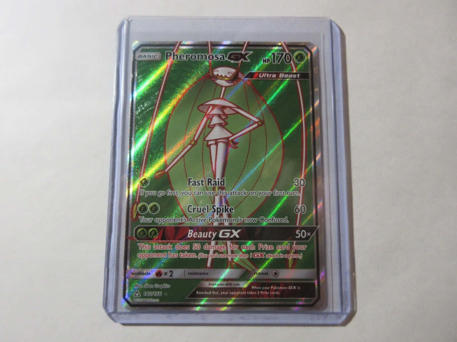 Pheromosa Pok Mon Trading Card Encased In A Clear Protective Wallpaper