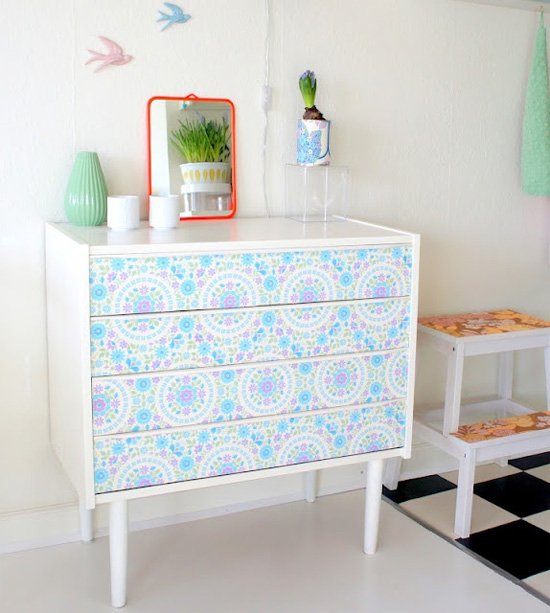Update a dresser Use wallpaper to line the front of the drawers