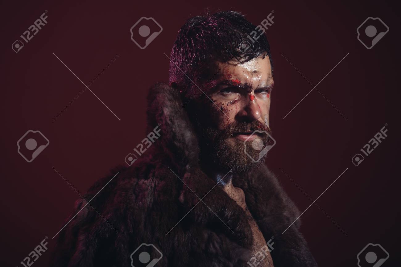 Man With Beard Mustache On Bloody Face In Fur Coat Purple