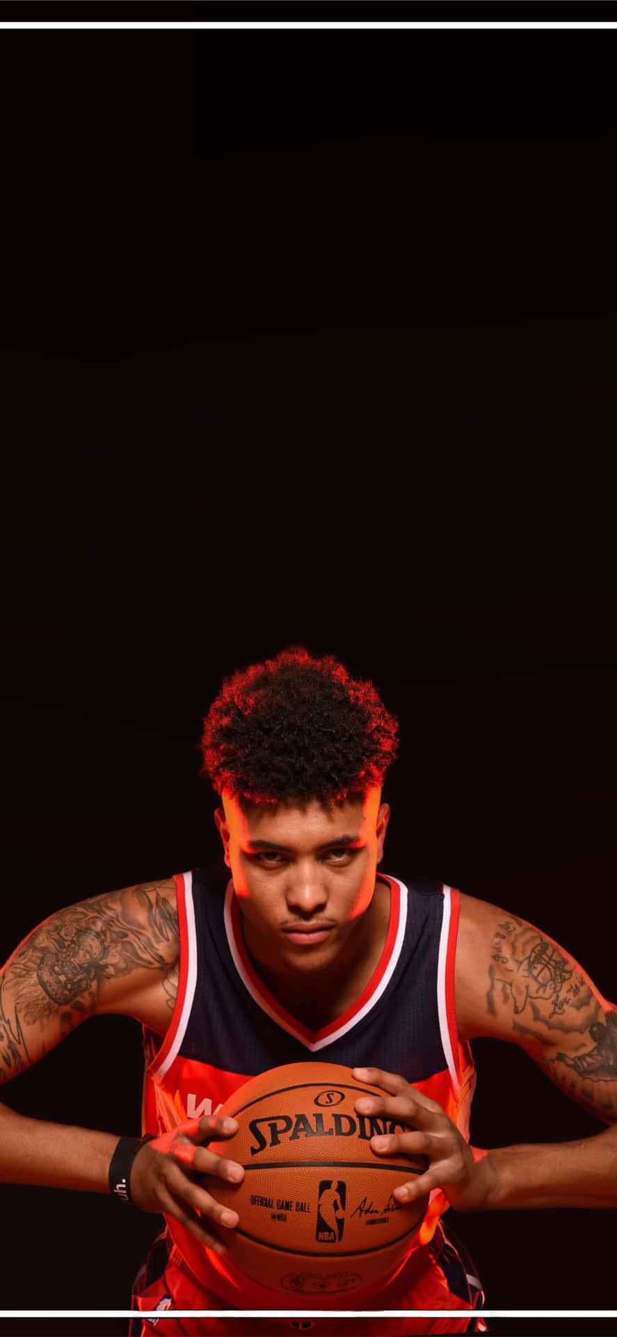 Shooting Guard Devin Booker Showcasing The New iPhone Wallpaper