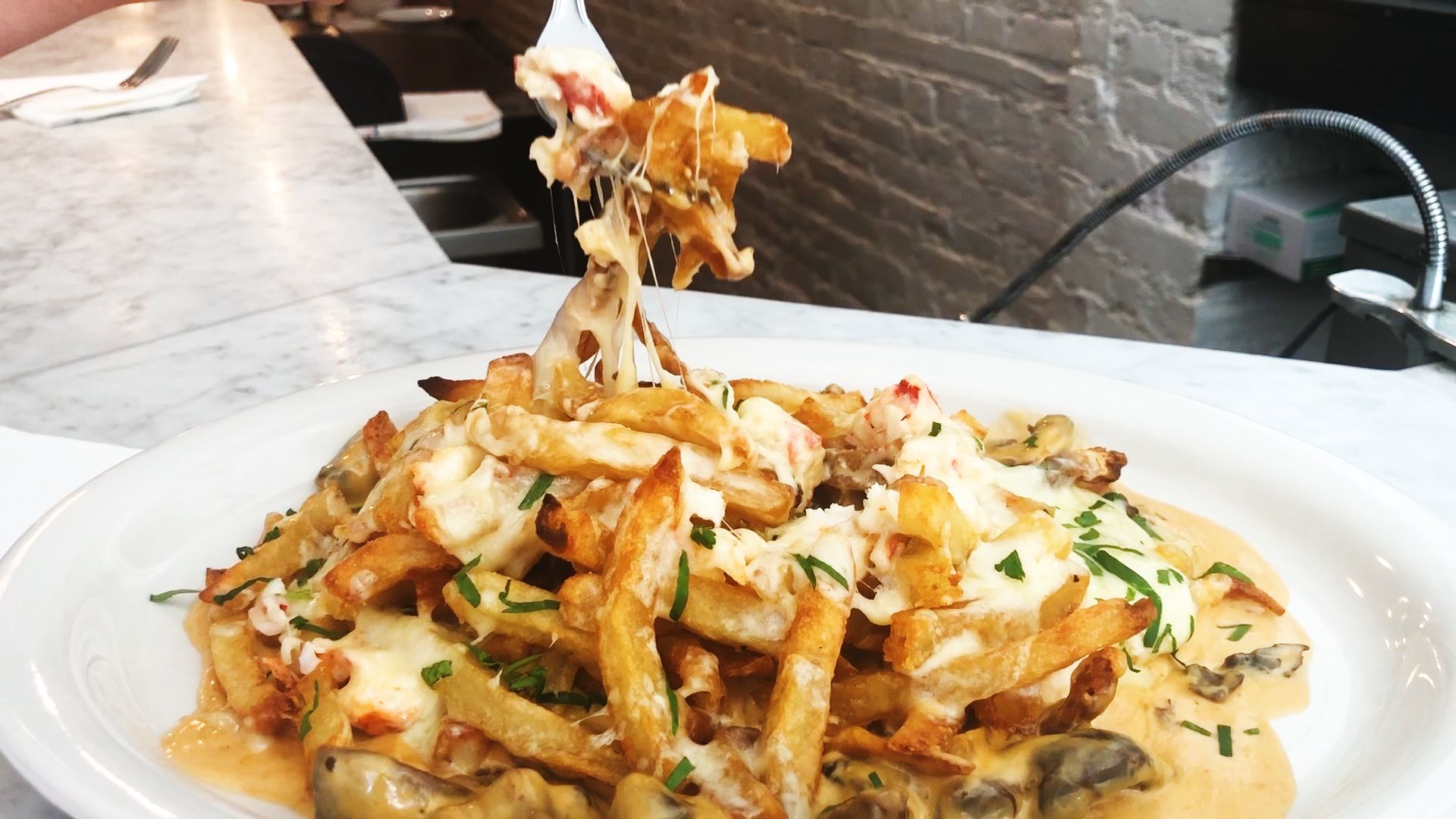 Ed S Lobster Bar In Nyc Serves Poutine Covered Bits And