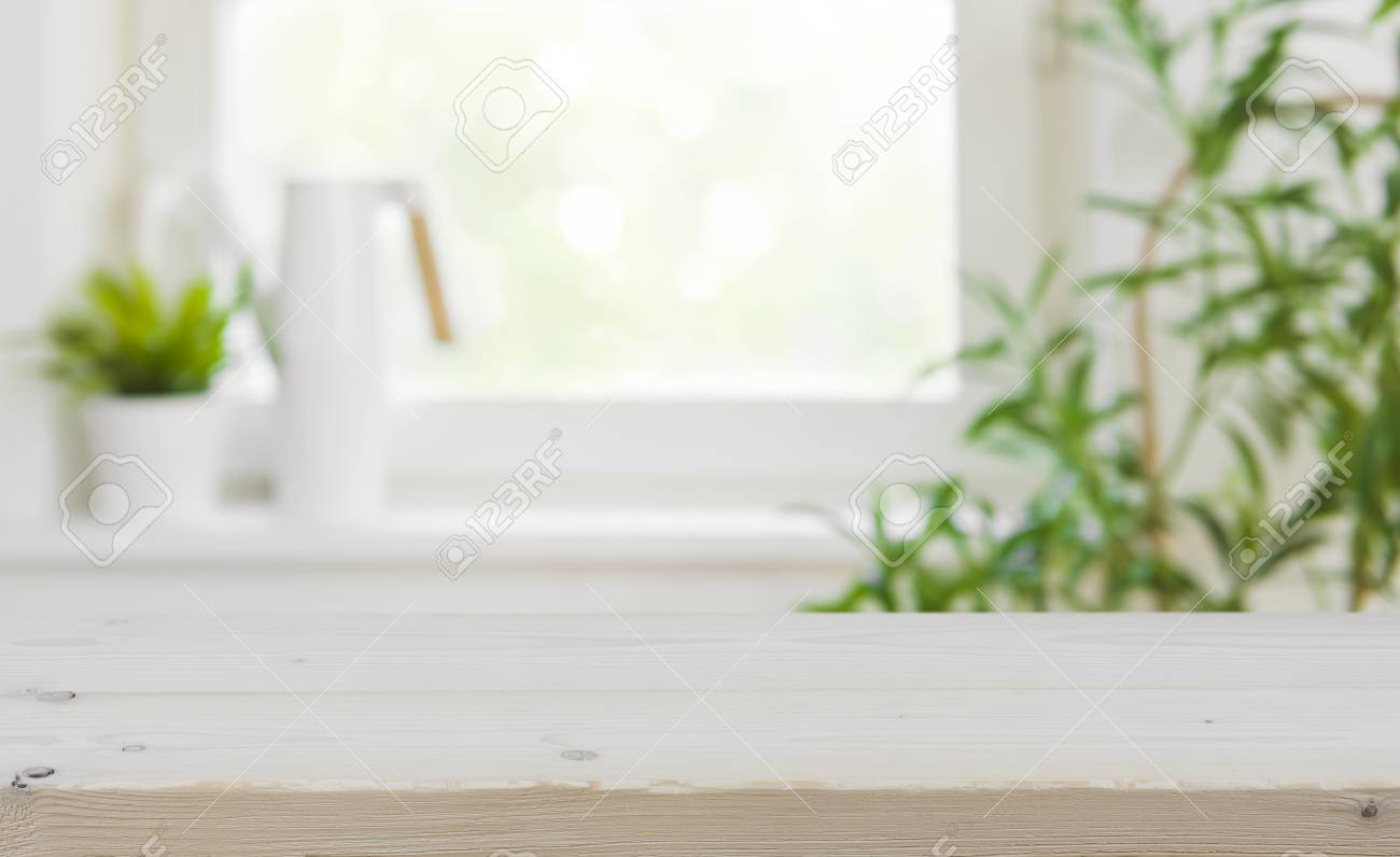 Wooden Tabletop With Copy Space Over Blurred Kitchen Window