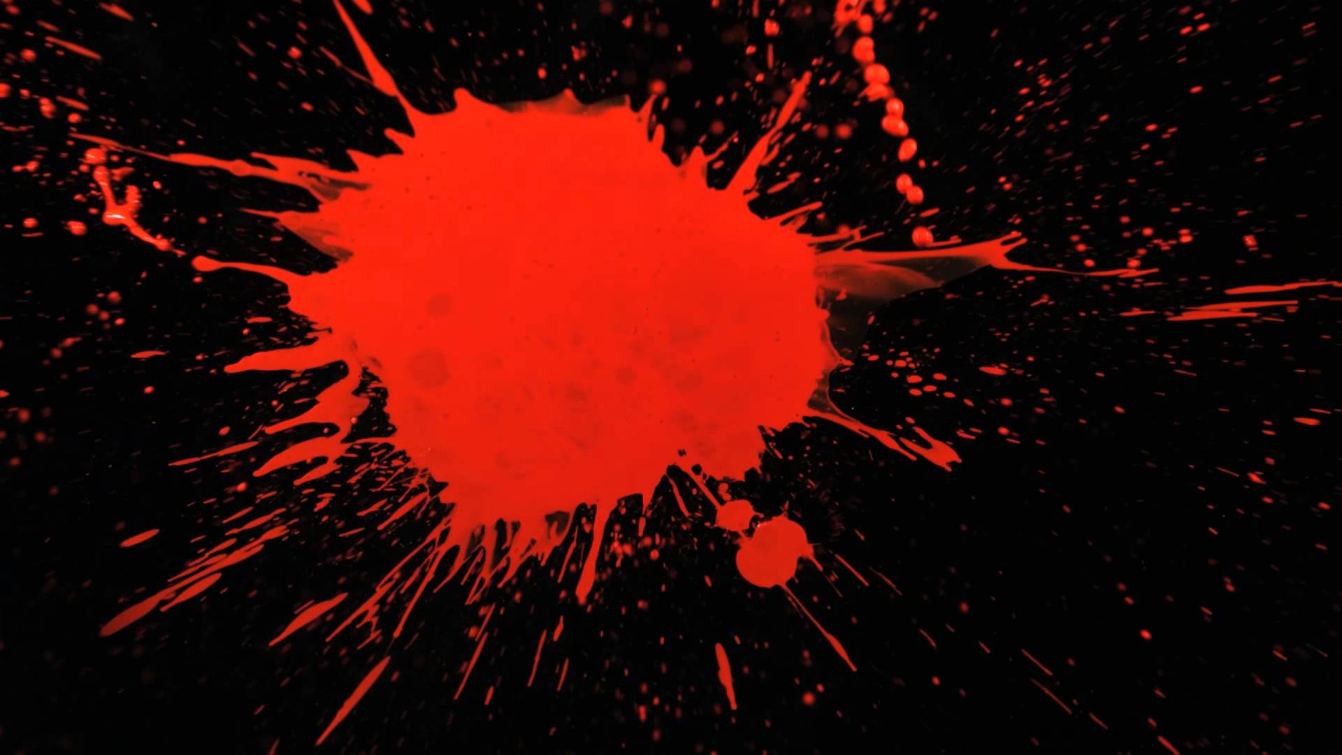 Motion Paint Splatter With Red Splattering A Black Background