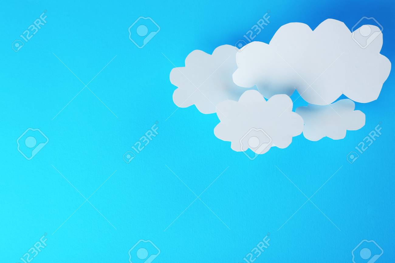 White Paper Clouds On Blue Background Cloud Puting Concept