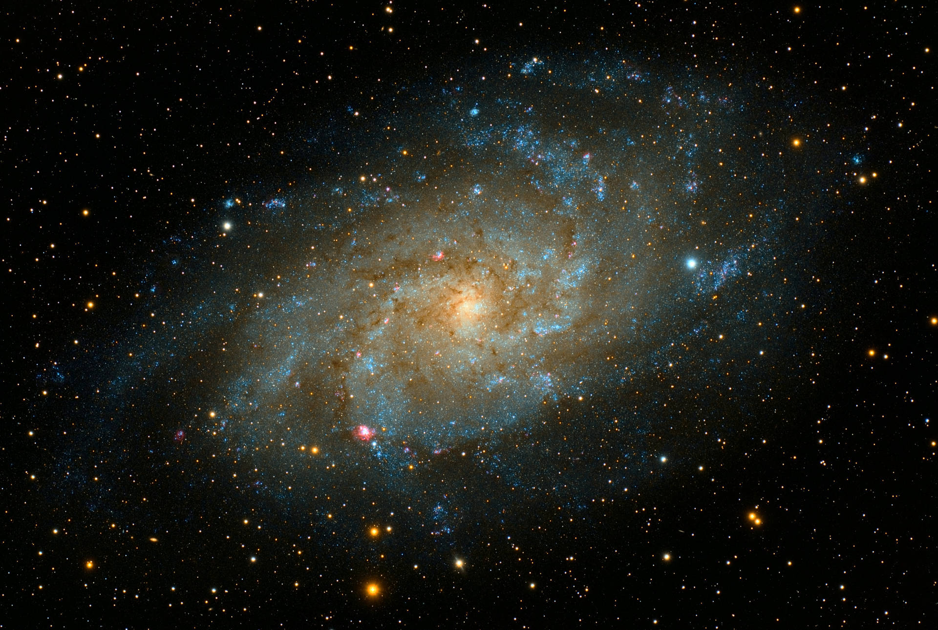 4k Spiral Galaxy With Red Yellow Blue Stars Wallpaper