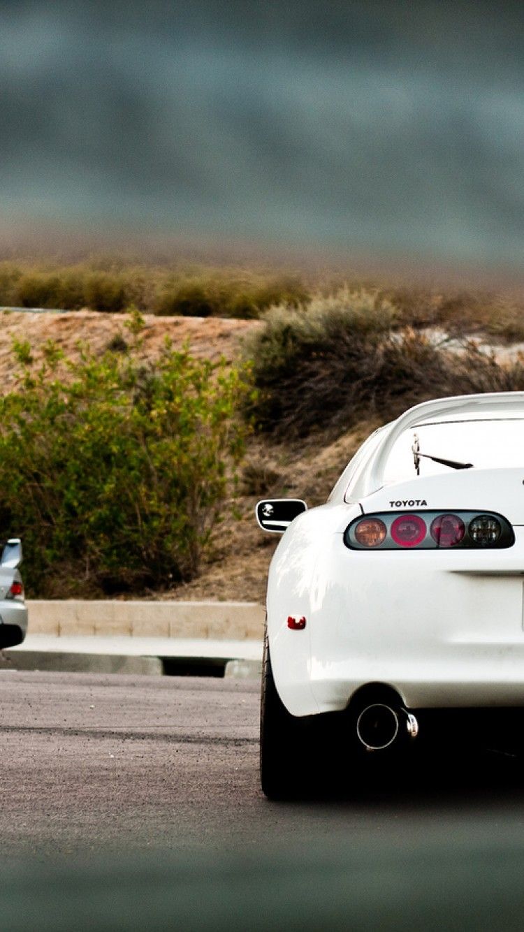 There S A Evo In The Background Toyota Supra