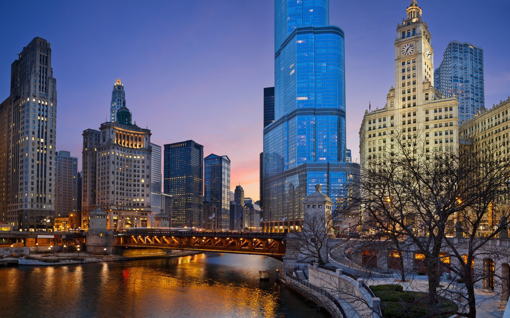 Stunning twilight view of the Chicago skyline with the Chicago River in the foreground