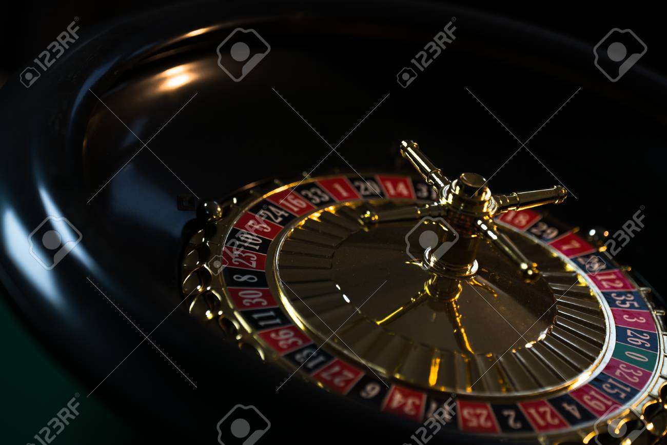 Casino Background Poker Chips On Gaming Table Roulette Wheel