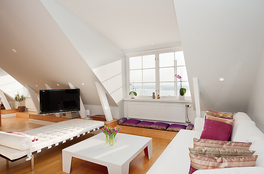 The Sloping Ceilings Are Lifted With White Whilst Eye Is Drawn