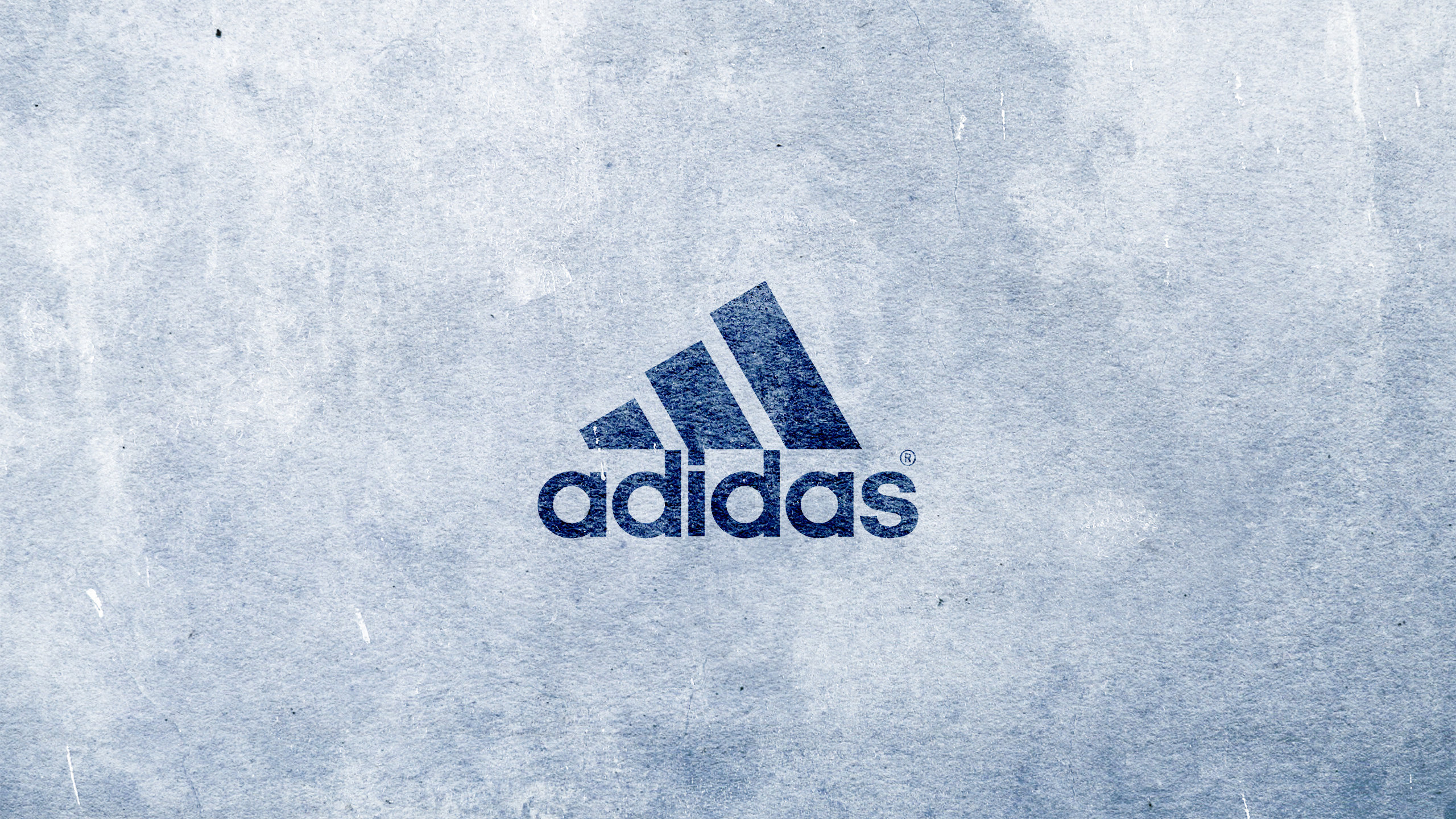 Adidas logo on a textured blue background