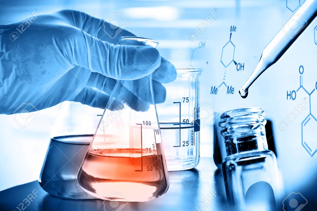 Flask In Scientist Hand With Laboratory Background Stock Photo