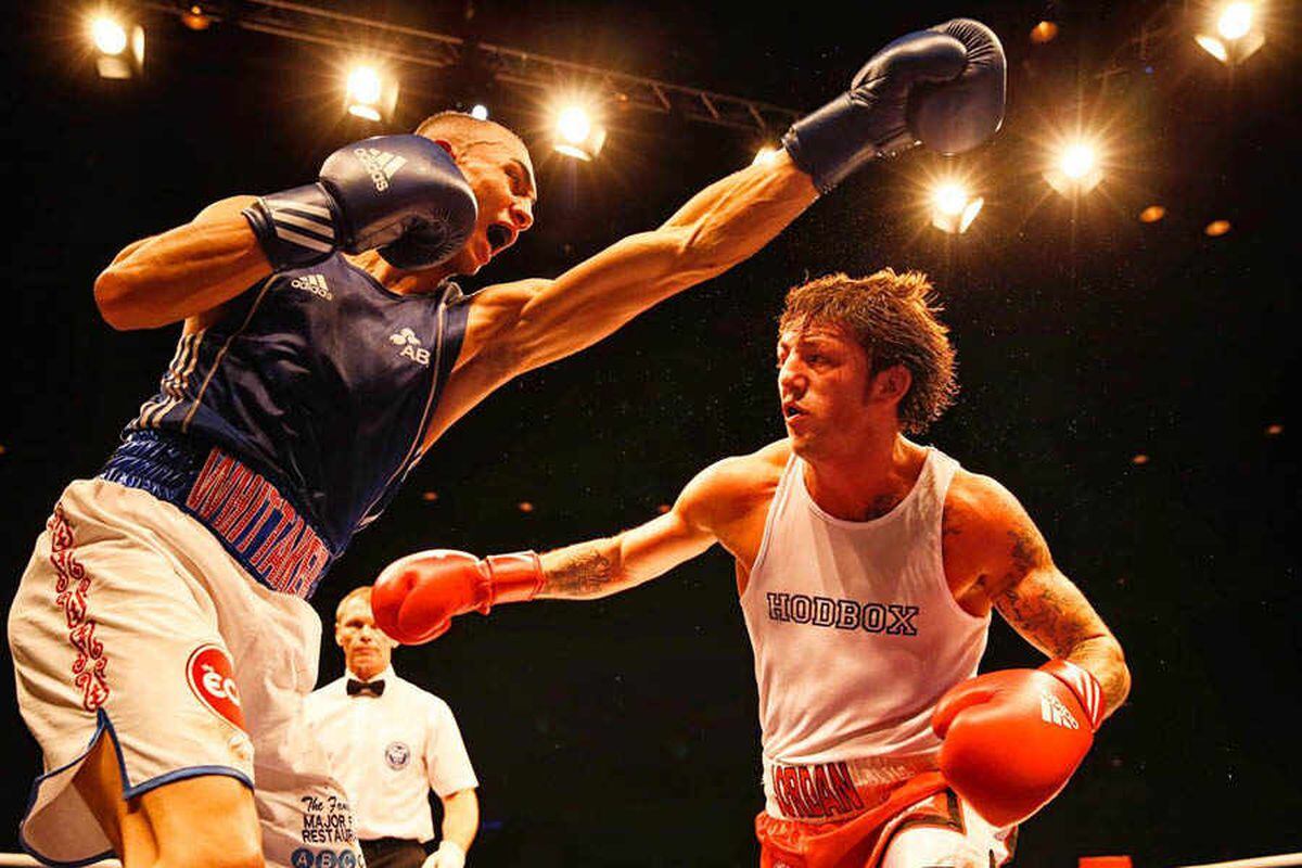 Benjamin Whittaker throwing a punch at his opponent during a boxing match