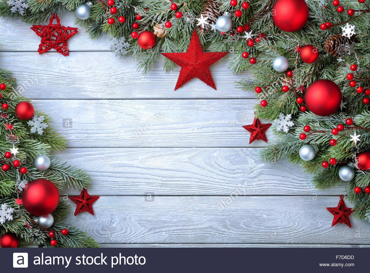 Christmas background with blue wooden board and fir branches Stock