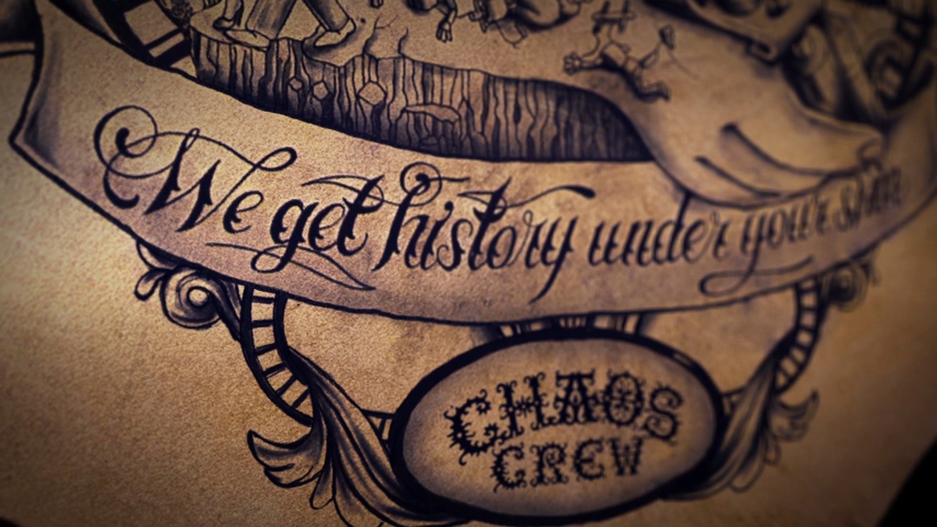 Close-up of a detailed tattoo featuring the words 'We get history under your skin' and 'Chaos Crew', suggesting a dedication to tattoo artistry and a specific group or style