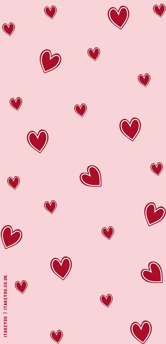 Red hearts on a pink background iPhone wallpaper