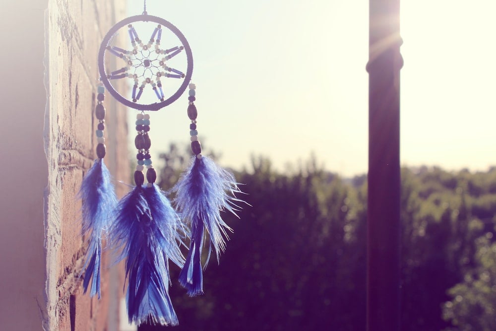 selective focus of hanging blue and black dream catcher photo